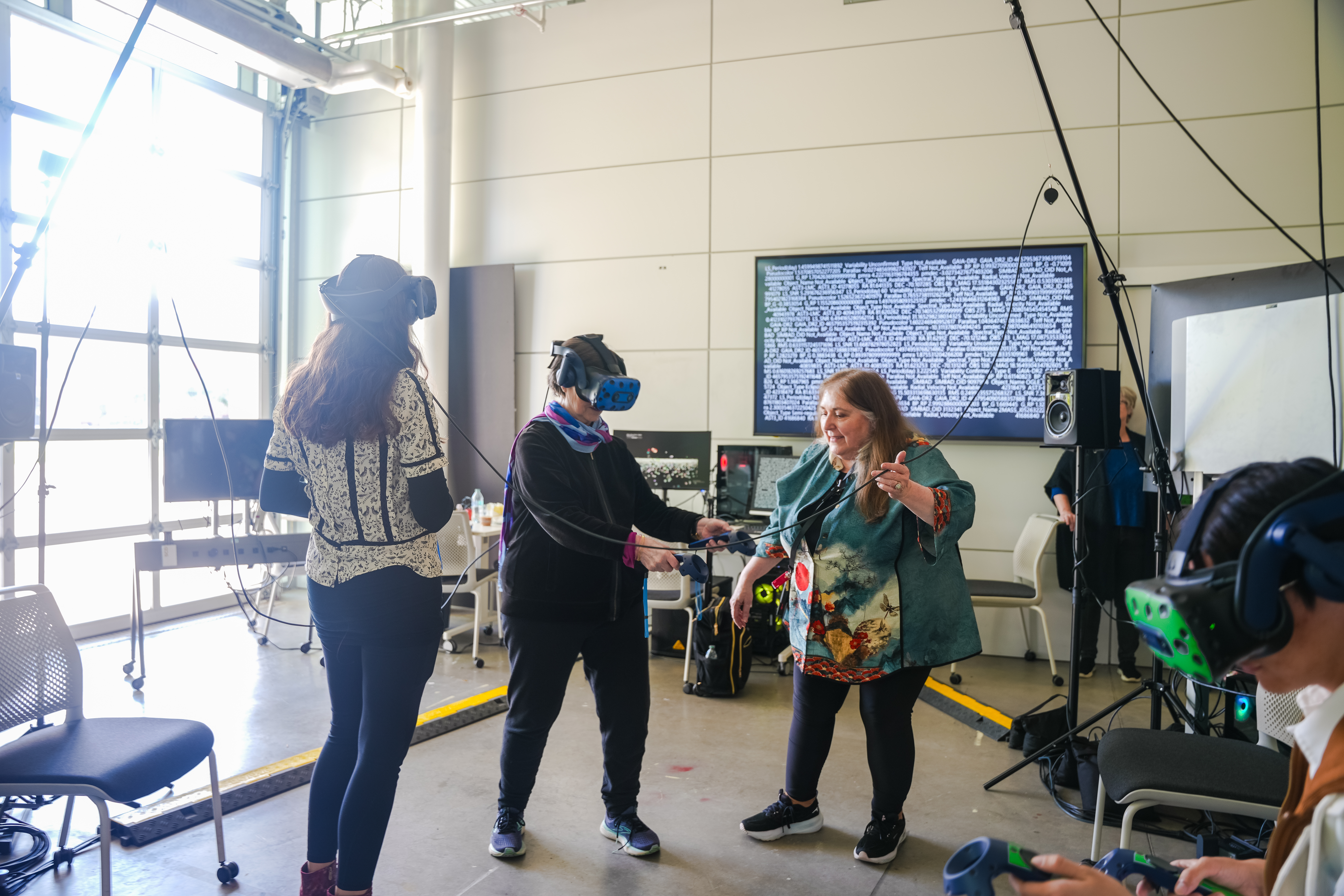 Ruth West guides an attendee through the IOAN VR Experience